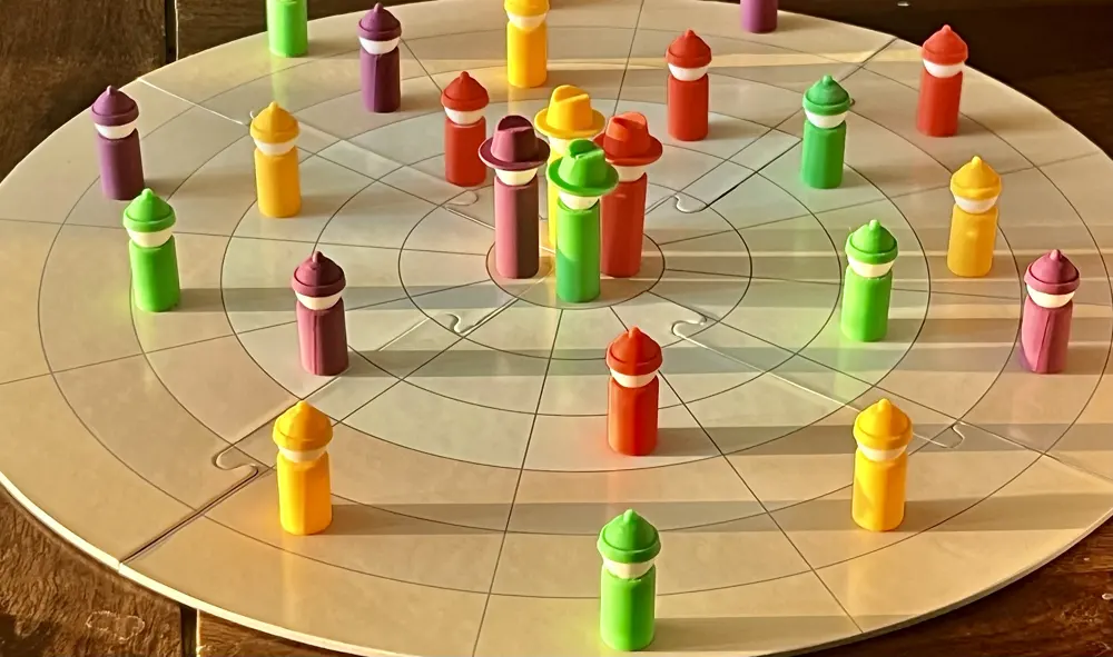 Henchmen of all four colours spread across the Encircle board, with the Dons in the safe house